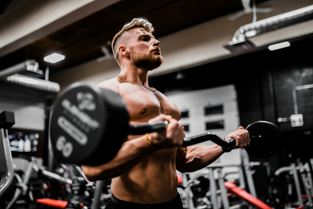 Athlete strength training with gym weights